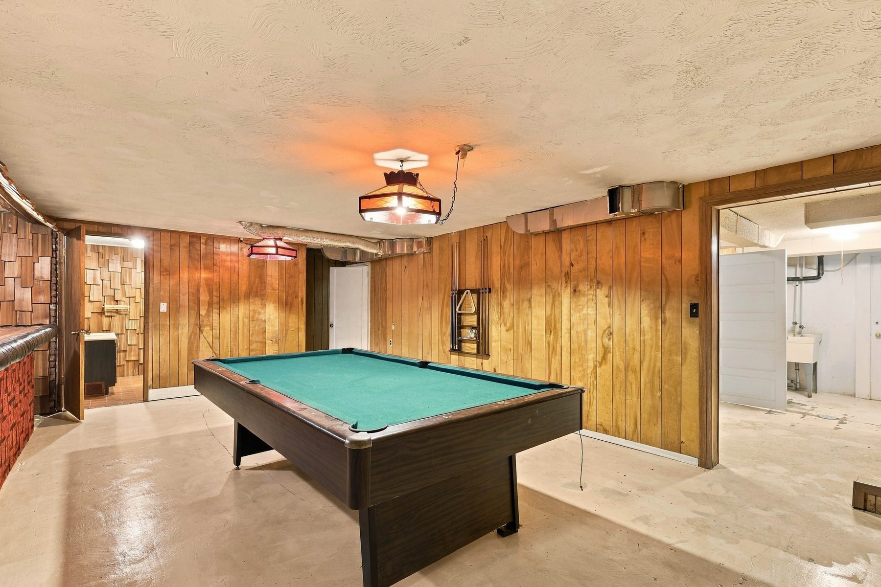 Basement rec room with built-in brick bar